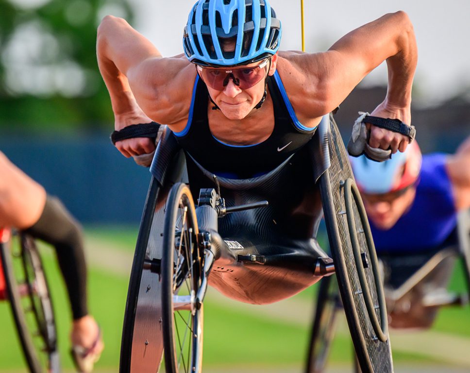 Susannah Scaroni, a three-time Paralympian who won gold at the 2020 Summer Paralympics, trains with her teammates on the Illinois Men’s and Women’s Wheelchair Track team during early morning workouts at the track at Demirjian Park.

At the age of five, Scaroni was injured in a car accident that damaged her spinal cord. More recently after the Tokyo games, she was struck by a vehicle during a training run. After a recent Chicago Marathon victory, Scaroni said, "I have a new appreciation to be alive and so I think about that constantly now and everything's a celebration and an opportunity and that's translated into my career."
Photo taken at the University of Illinois Urbana-Champaign on Friday, July  26, 2024. 
(Photo by Fred Zwicky / University of Illinois Urbana-Champaign)